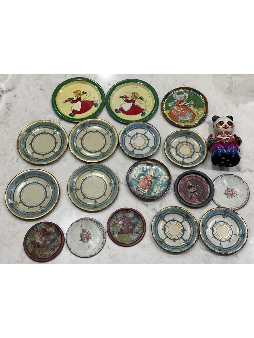 Vintage Collection decorative metal plates featuring illustrations & Panda Tin